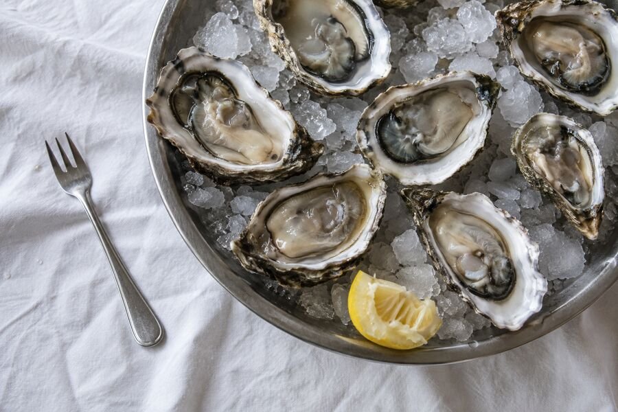 Opened oysters served on crushed ice